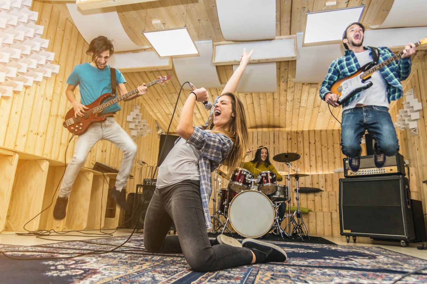Group of musician recording at the studio.
